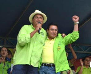 Correa with former Coopera general manager Rodrigo Acay during a 2012 campaign rally.