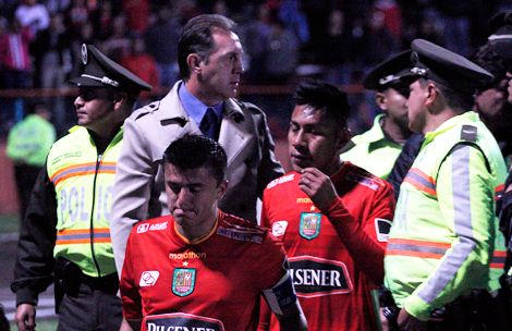 Dejected Cuenca players walk off the pitch Wednesday night.