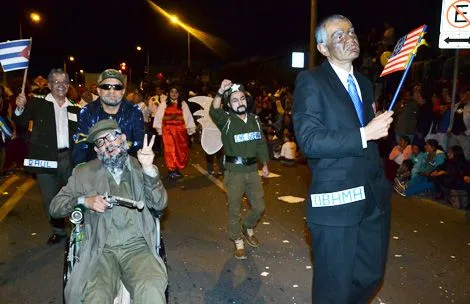 A wheelchair-bound Fidel Castro was part of the spoofing at Tuesday night's parade of the innocents.