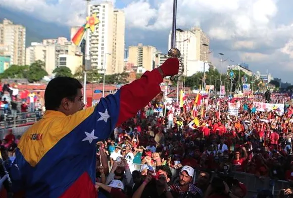 A sword-wielding Nicolas Madura at a Sunday rally in Caracas.