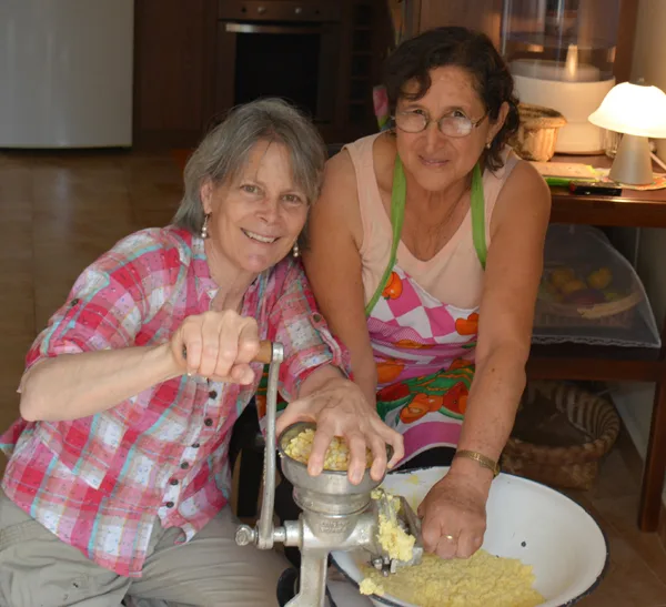 Viktoria and Orfa hand-grind corn.