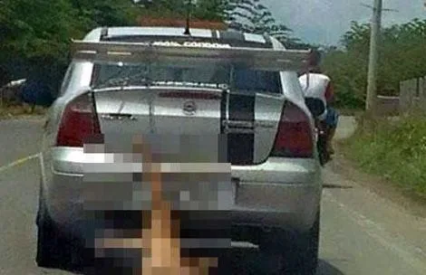 Social media picture of dog being dragged behind car.