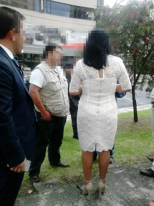 Esperanza G. being arrested Sunday in Quito.