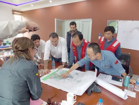 Chinese company officials review mine plans last week in Zamora Chinchipe .