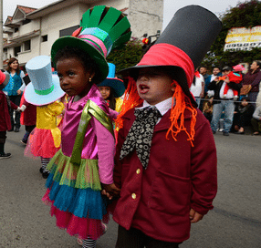 Men in drag, cutting satire, and kids in make-believe highlight Saturday’s masquerade parade