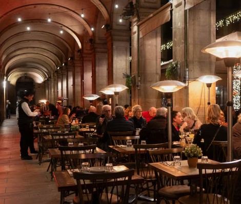 Barcelona diners enjoy the last days of outdoor winter warmth as gas heaters are banned