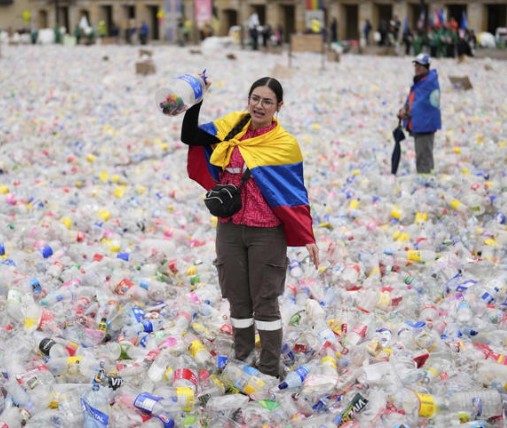Colombian ‘waste pickers’ cover Bogota plaza with plastic to protest lower recycling income