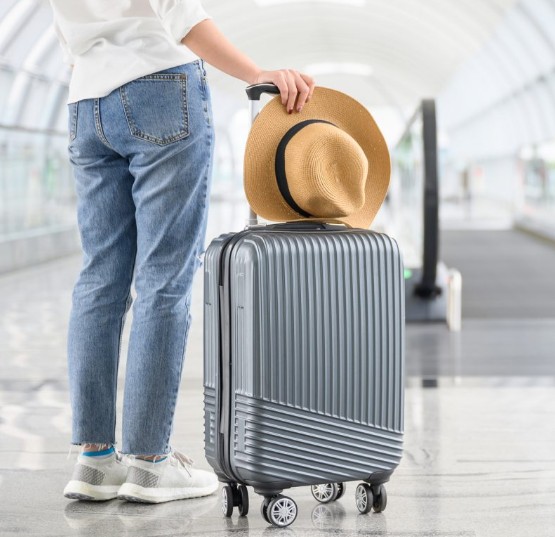 Carry-on luggage is causing big headaches for travelers — and making big profits for the airlines